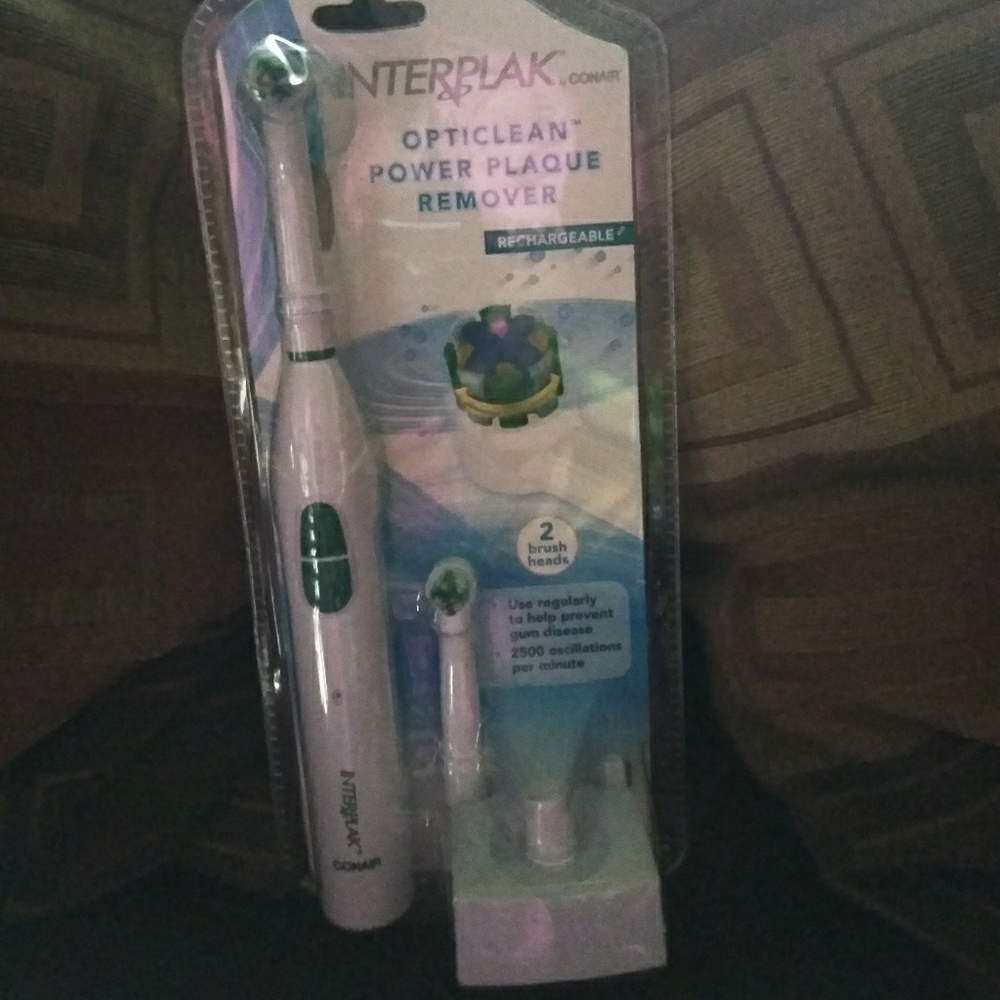 A rechargeable electric Conair toothbrush